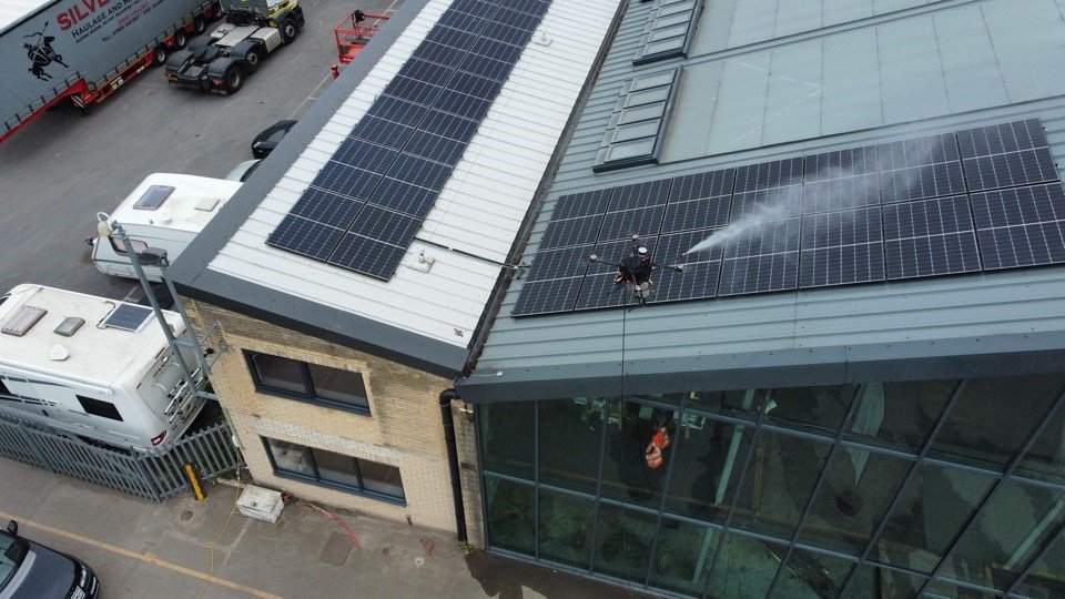 Drone cleaning a commercial solar array