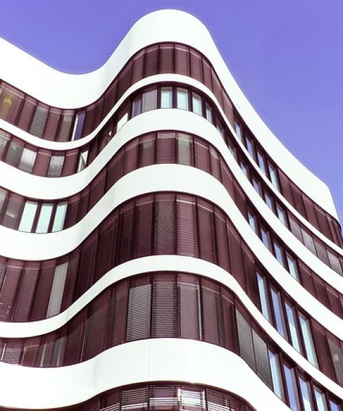 Commercial drone pressure washing exterior brick building